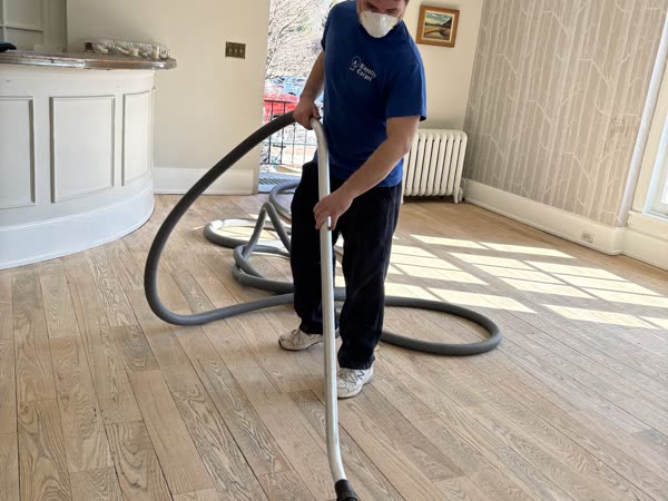 IICRC-certified technician cleaning carpet in a Hudson Valley home