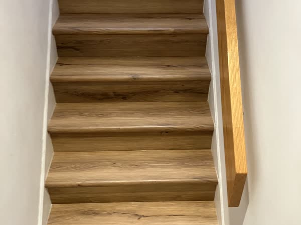 Wood-look plank staircase installation